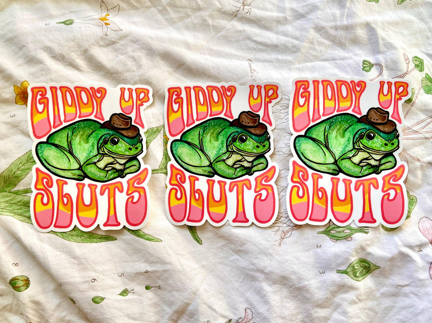 "Giddy Up Sluts" Cowboy Frog Bumper Sticker and Magnet